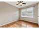 A well-lit bedroom with hardwood floors, a ceiling fan, and natural light at 3826 Ensign Dr, Chamblee, GA 30341