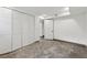 A minimalist bedroom with a closet, a door, and a concrete floor at 3826 Ensign Dr, Chamblee, GA 30341