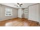 A light filled bedroom with hardwood floors and double closets at 3826 Ensign Dr, Chamblee, GA 30341