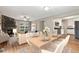 Bright dining room open to the living room, featuring hardwood floors and stylish decor at 3826 Ensign Dr, Chamblee, GA 30341