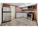 Kitchen with stainless steel appliances and brick wall at 3826 Ensign Dr, Chamblee, GA 30341