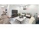 Modern living room with a sofa, chairs, a marble coffee table, and a TV at 3826 Ensign Dr, Chamblee, GA 30341