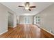 Bright and airy living room with hardwood floors, featuring french doors and neutral wall color at 3826 Ensign Dr, Chamblee, GA 30341