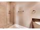 Bathroom showcases tiled shower with glass enclosure and granite countertop at 384 16Th Nw St # 1, Atlanta, GA 30363
