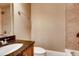 Bathroom featuring a granite countertop, a single vanity, and tiled shower and tub surround at 384 16Th Nw St # 1, Atlanta, GA 30363