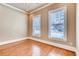 Bedroom with hardwood floors, neutral walls, crown molding, and lots of natural light at 384 16Th Nw St # 1, Atlanta, GA 30363