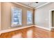 Cozy bedroom with hardwood floors, neutral walls, crown molding, and lots of natural light at 384 16Th Nw St # 1, Atlanta, GA 30363