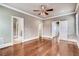 Bright bedroom with wood floors and white trim, leading to multiple doorways at 384 16Th Nw St # 1, Atlanta, GA 30363