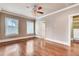 Spacious bedroom featuring hardwood floors, neutral walls, and a ceiling fan with light fixture at 384 16Th Nw St # 1, Atlanta, GA 30363