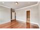 Spacious bedroom features hardwood floors, white trim, and neutral paint palette at 384 16Th Nw St # 1, Atlanta, GA 30363