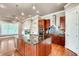 Modern kitchen boasts an island, stainless appliances, and custom cabinets at 384 16Th Nw St # 1, Atlanta, GA 30363