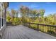 Large wooden deck perfect for outdoor entertaining with a beautiful view of the surrounding trees at 6454 Meridian Way, Atlanta, GA 30328