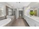 Large Primary bathroom with double vanity, soaking tub, and glass shower at 6454 Meridian Way, Atlanta, GA 30328