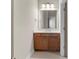 Bathroom featuring a marble countertop, wood cabinet, and modern fixtures at 6454 Meridian Way, Atlanta, GA 30328