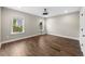 Inviting bedroom with ample natural light and hardwood floors, offering a comfortable and relaxing retreat for rest and rejuvenation at 6454 Meridian Way, Atlanta, GA 30328