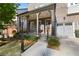 Well-maintained two-story brick home with a covered front porch, professional landscaping, and a two-car garage at 6454 Meridian Way, Atlanta, GA 30328