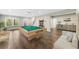 Entertain in this spacious game room with a billiards table, wet bar and seating, perfect for recreation and relaxation at 6454 Meridian Way, Atlanta, GA 30328