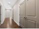 View of the hallway with hardwood floors and gray doors at 6454 Meridian Way, Atlanta, GA 30328