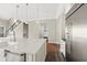 Kitchen with stainless steel appliances, a large island, and easy access to the pantry at 6454 Meridian Way, Atlanta, GA 30328