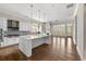 Bright and airy kitchen featuring a large central island, stainless steel appliances and an open concept at 6454 Meridian Way, Atlanta, GA 30328
