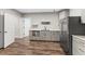 Convenient kitchenette area complete with stainless steel appliances and a sleek design, ideal for quick meal preparations at 6454 Meridian Way, Atlanta, GA 30328