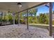 Covered patio with brick flooring, a swing and wooded view at 6454 Meridian Way, Atlanta, GA 30328