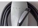 Close-up of a Tesla home charging connector, designed for quick and easy EV charging at 6454 Meridian Way, Atlanta, GA 30328
