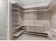Custom walk-in closet with built-in shelving, drawers, and ample storage space at 6454 Meridian Way, Atlanta, GA 30328
