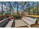 Enjoy outdoor living on the back deck with comfortable seating and wooded views at 823 Canterbury Overlook, Atlanta, GA 30324