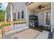 Outdoor grill and back porch area with comfortable seating, perfect for entertaining or relaxing outdoors at 823 Canterbury Overlook, Atlanta, GA 30324