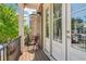 Cozy balcony with a charming chair and framed by a lush tree canopy at 823 Canterbury Overlook, Atlanta, GA 30324