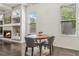 Cozy dining area with a view of the fireplace and natural light at 823 Canterbury Overlook, Atlanta, GA 30324
