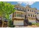 Charming two-story brick townhome featuring a private balcony and an attached two-car garage at 823 Canterbury Overlook, Atlanta, GA 30324