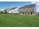Grassy back yard showcasing a spacious yard and the back of the home at 1439 Veranda Ln, Mcdonough, GA 30253