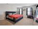 Bedroom featuring carpeted floor, a queen size bed and two large windows with black curtains at 1439 Veranda Ln, Mcdonough, GA 30253