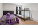 Bedroom featuring carpeted floor, a bunk bed, and a full size bed with zebra print cover at 1439 Veranda Ln, Mcdonough, GA 30253