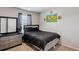 Bedroom featuring carpeted floor, a queen size bed and a dresser with decor at 1439 Veranda Ln, Mcdonough, GA 30253