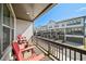 Spacious balcony with red Adirondack chairs overlooking townhome community at 4068 Allegretto Se Cir # 10, Atlanta, GA 30339