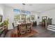 Open dining area features natural light, modern light fixtures and views to the backyard at 4068 Allegretto Se Cir # 10, Atlanta, GA 30339