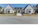 Charming single-story building featuring a painted brick facade, symmetric design, and well-manicured landscaping at 4068 Allegretto Se Cir # 10, Atlanta, GA 30339