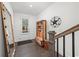 Stylish foyer with a unique hall tree, rustic mirror, and modern finishes at 4068 Allegretto Se Cir # 10, Atlanta, GA 30339