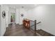 Hallway with beautiful hardwood floors leading to the staircase at 4068 Allegretto Se Cir # 10, Atlanta, GA 30339