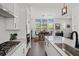 Kitchen leading into dining area with views to the backyard through windows at 4068 Allegretto Se Cir # 10, Atlanta, GA 30339