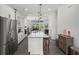 Modern kitchen with stainless steel appliances, white cabinetry, and a large island at 4068 Allegretto Se Cir # 10, Atlanta, GA 30339