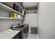 Modern laundry room with stainless steel washer/dryer and counter space at 4068 Allegretto Se Cir # 10, Atlanta, GA 30339