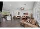 Open-concept living area featuring hardwood floors and ample seating at 4068 Allegretto Se Cir # 10, Atlanta, GA 30339