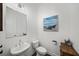 Quaint powder room features modern fixtures, toilet and sink at 4068 Allegretto Se Cir # 10, Atlanta, GA 30339