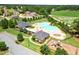 Community amenities include a pool, playground, and clubhouse, nestled in a residential neighborhood with green fields at 4580 Cloister Cir, Hampton, GA 30228