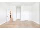 Large, bright bedroom with neutral walls and carpet with two closet doors is waiting for your personal touch at 4580 Cloister Cir, Hampton, GA 30228