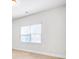 Bright room with white walls, neutral carpet, and natural light coming through the large window at 4580 Cloister Cir, Hampton, GA 30228